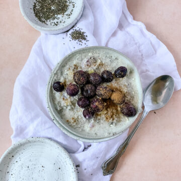 a bowl of chia seed pudding with blueberries