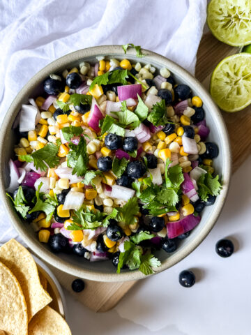 a bowl of blueberry and corn salsa