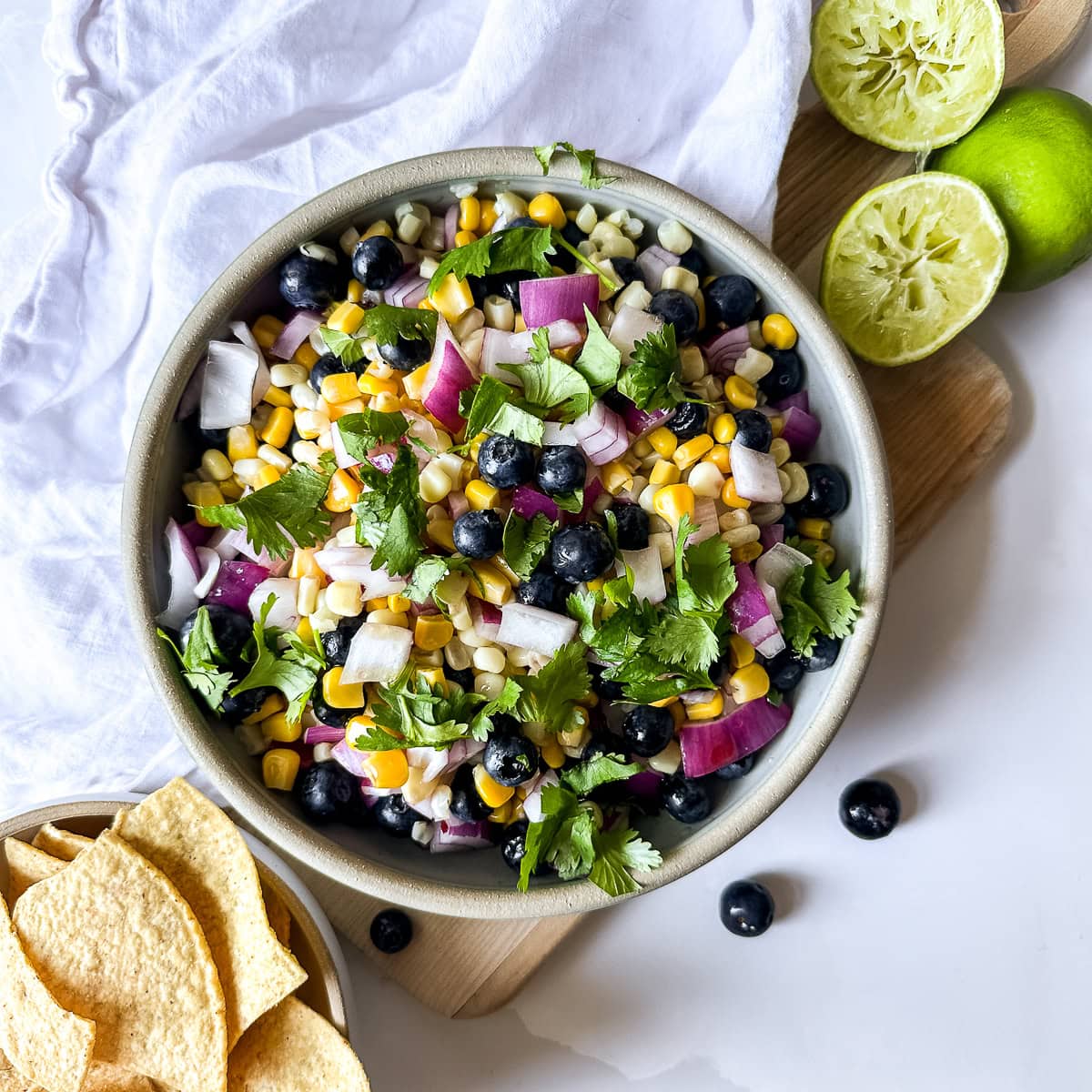 a bowl of blueberry and corn salsa