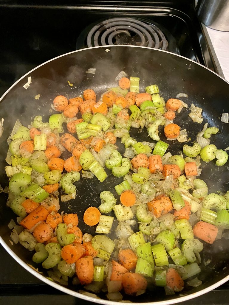 Saute celery, carrots, and onion for buffalo soup