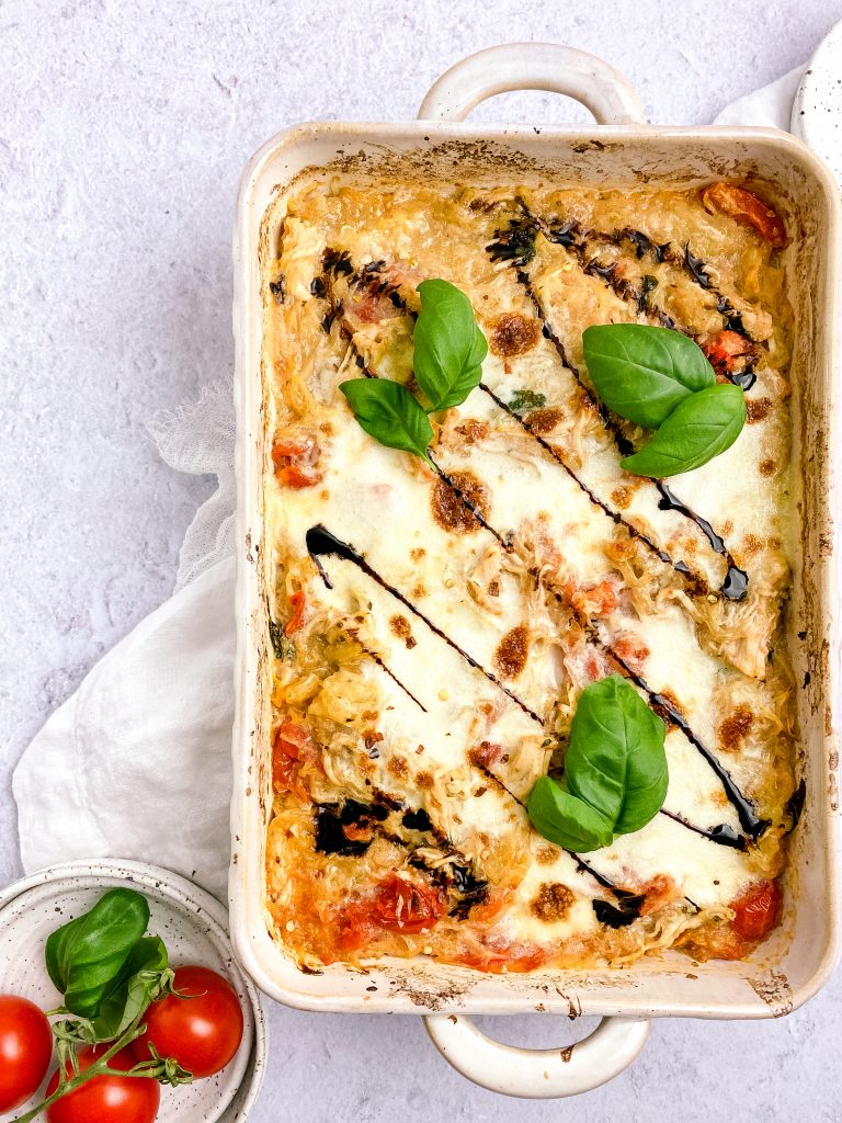 casserole topped with basil, cheese, and balsamic 