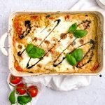 casserole dish with basil, tomatoes, and balsamic