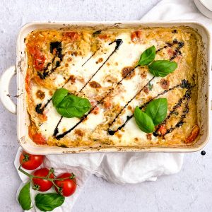 casserole dish with basil, tomatoes, and balsamic