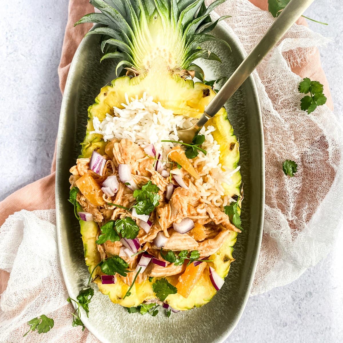 chicken and rice served in a pineapple