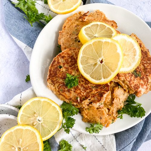 tuna patties with lemon slices on a plate