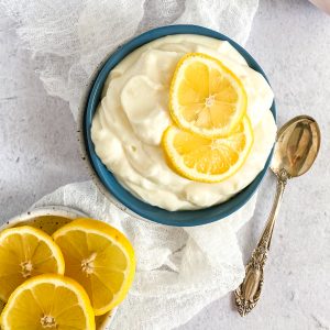 a blue bowl with lemon pudding dessert