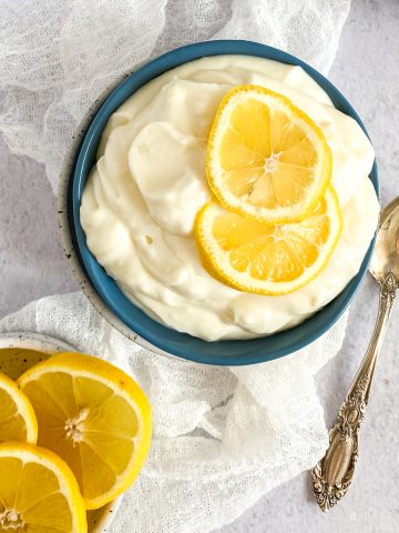 a blue bowl with lemon pudding dessert