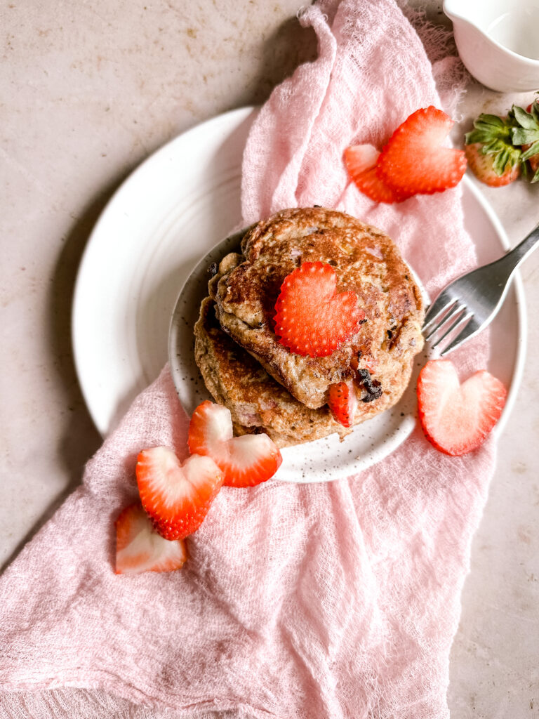 pancakes with heart shaped strawberries on top