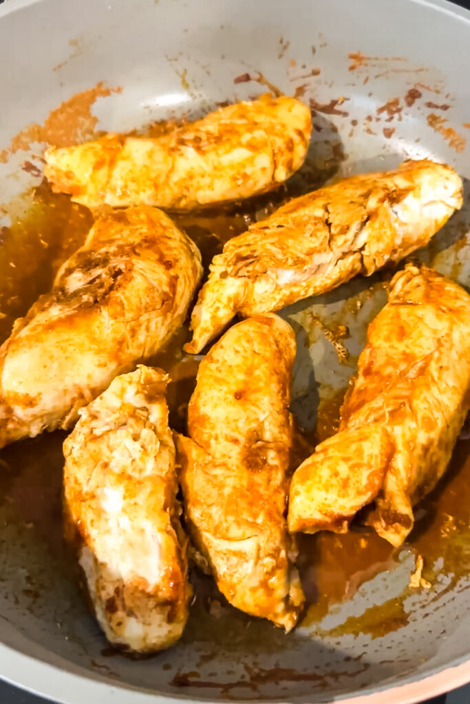 cooking chicken in pan 