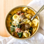 a bowl of tortellini soup
