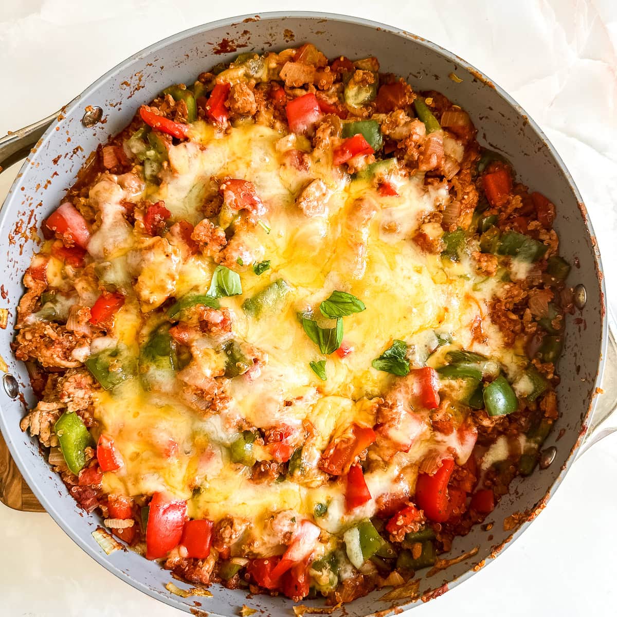 a cooked unstuffed peppers recipe in a white pan