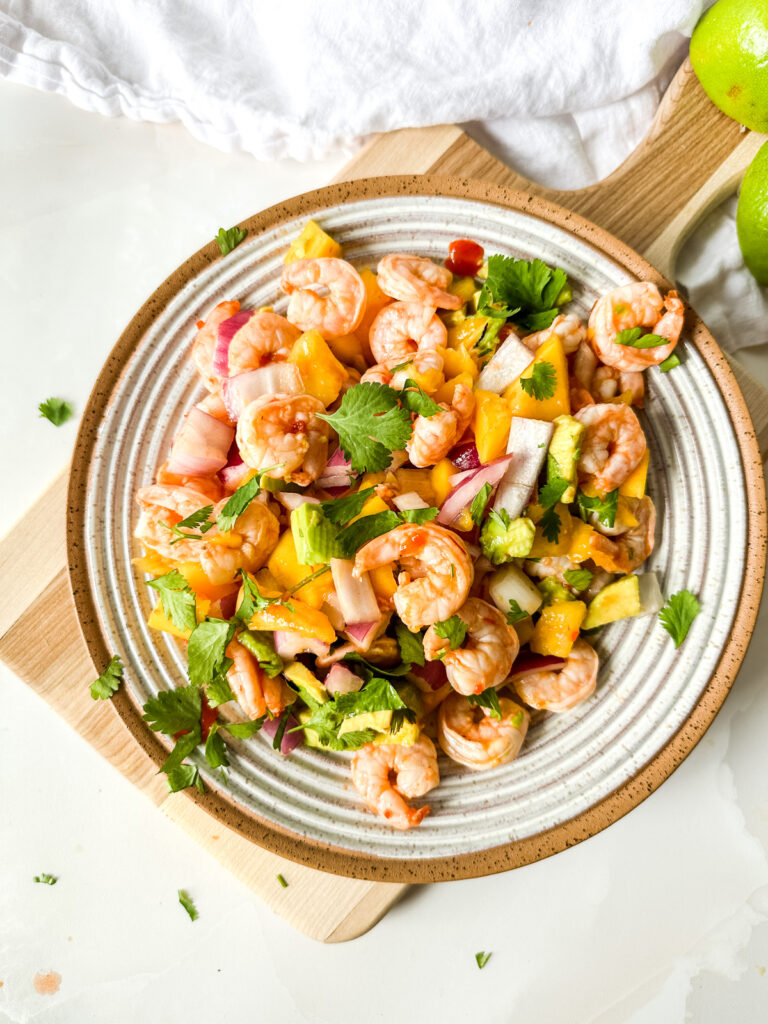 A bowl of mango shrimp salsa