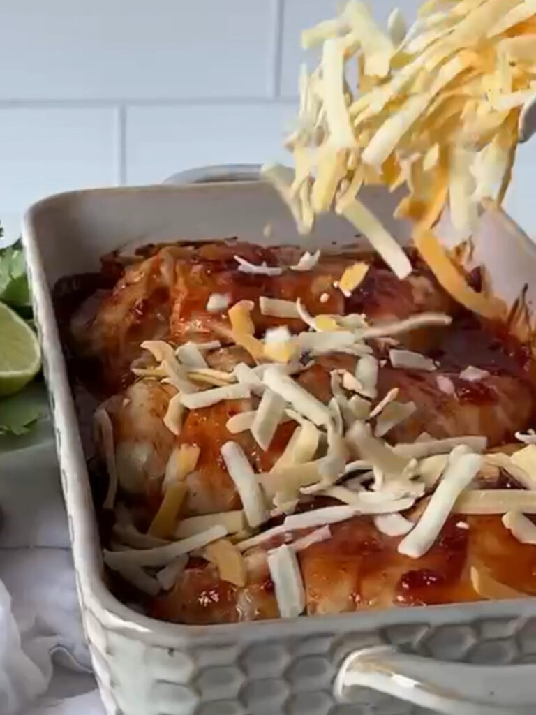putting cheese on salsa chicken