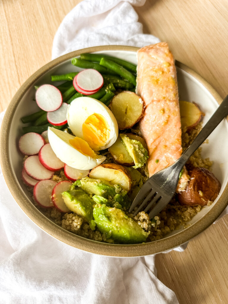 a hearty bowl of Niçoise salad with salmon
