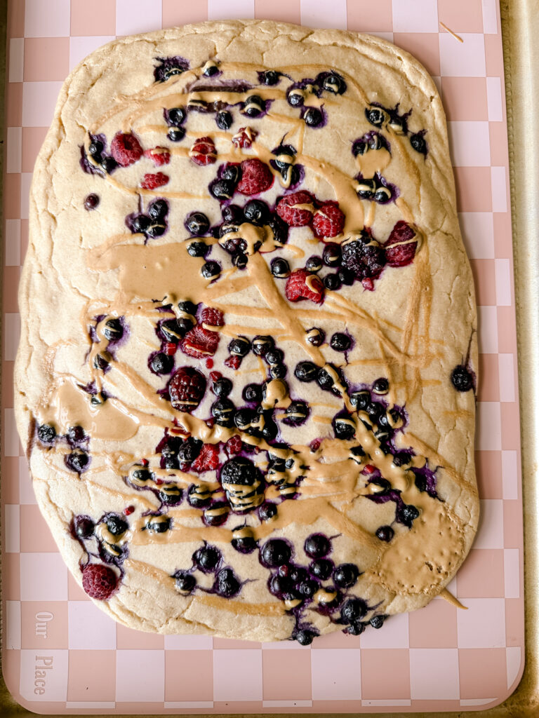 Baked Protein Pancakes on a sheet pan with berries