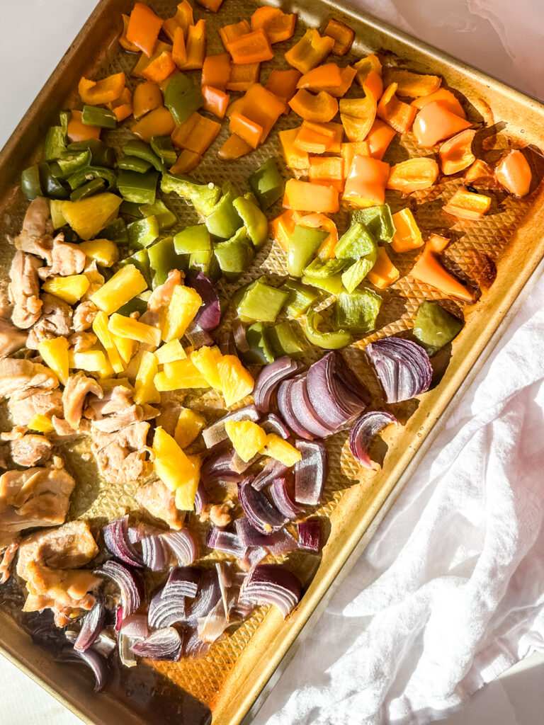 Hawaiian Sheetpan Chicken layered on a sheetpan