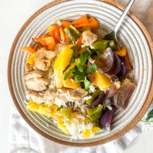 Hawaiian Sheetpan Chicken in a bowl with rice