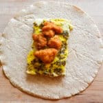 crispy chicken breakfast burritos before wrapping burrito