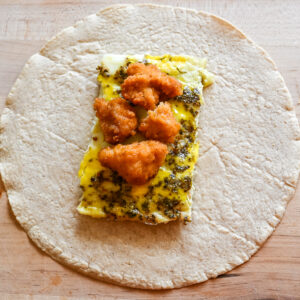 crispy chicken breakfast burritos before wrapping burrito