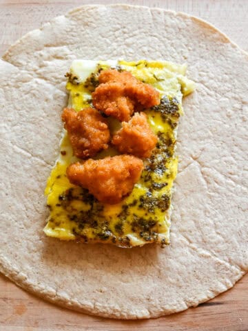crispy chicken breakfast burritos before wrapping burrito